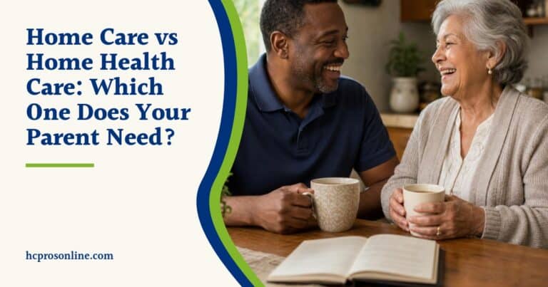 A caregiver and an older woman laugh together over tea at a sunlit kitchen table at home.